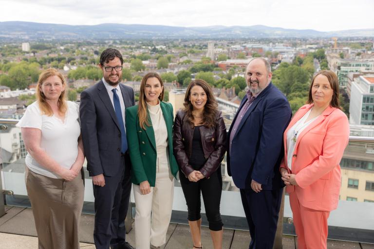 6 People standing on roof balcony