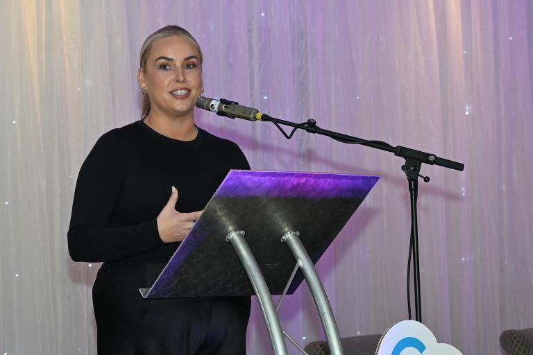 Woman Speaking at Podium