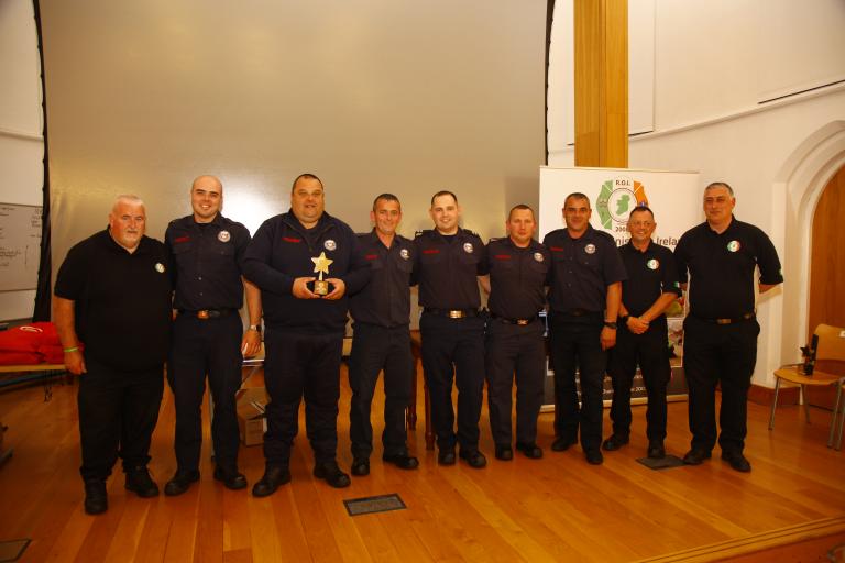 Group of fire officers with award