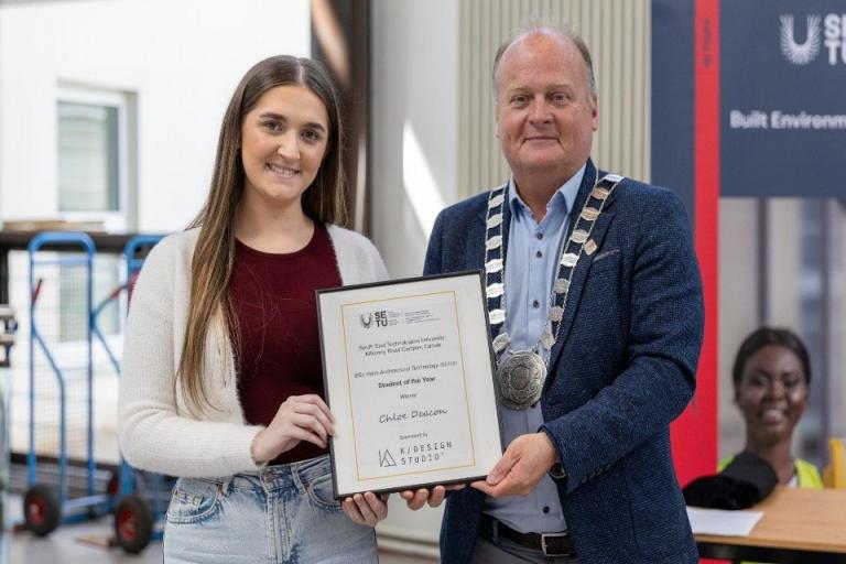 Student receiving award