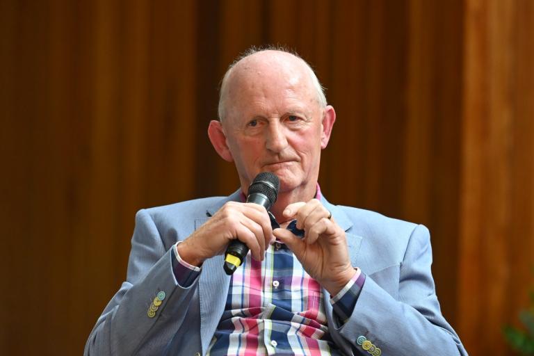 Man Sitting with Microphone