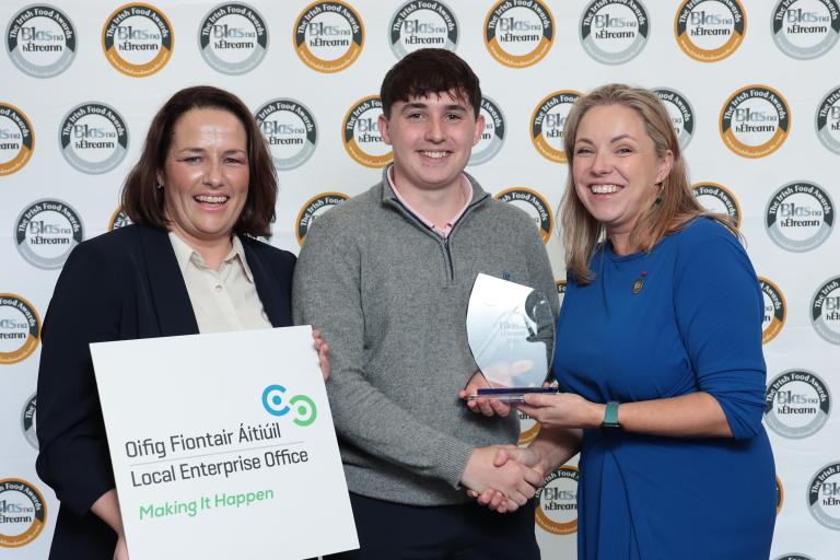 2 women and a man at prize giving