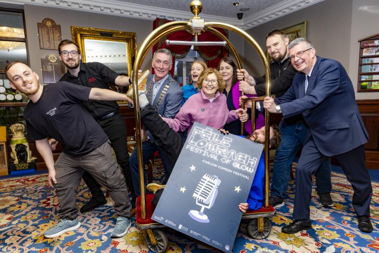 people standing with a luggage trolley