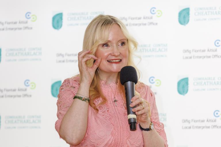 Woman in Pink Dress with microphone