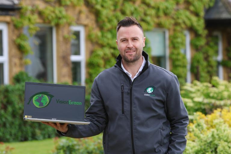 Man Holding a Laptop