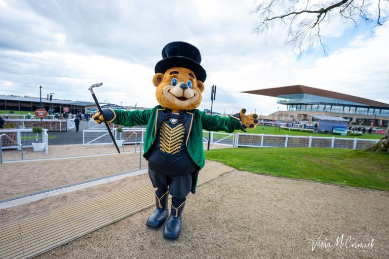Large teddy bear with top hat and cane