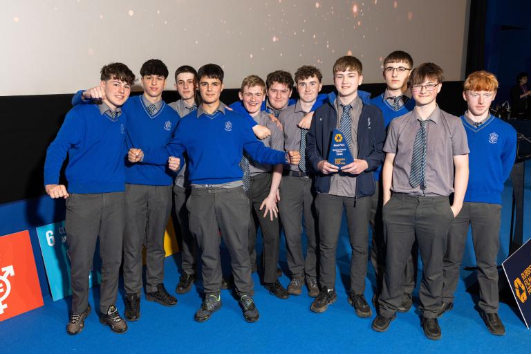 Group of students holding a prize
