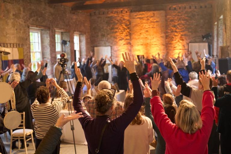Group with arms in the air