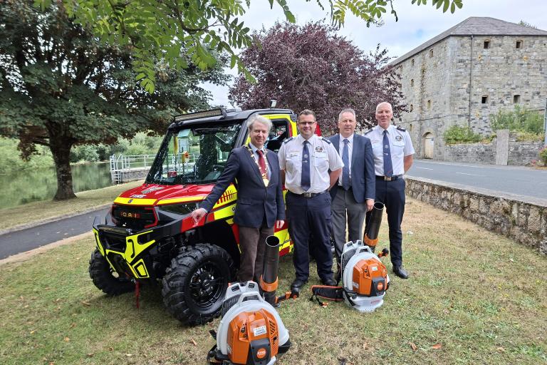 Men standing at fire vehicle