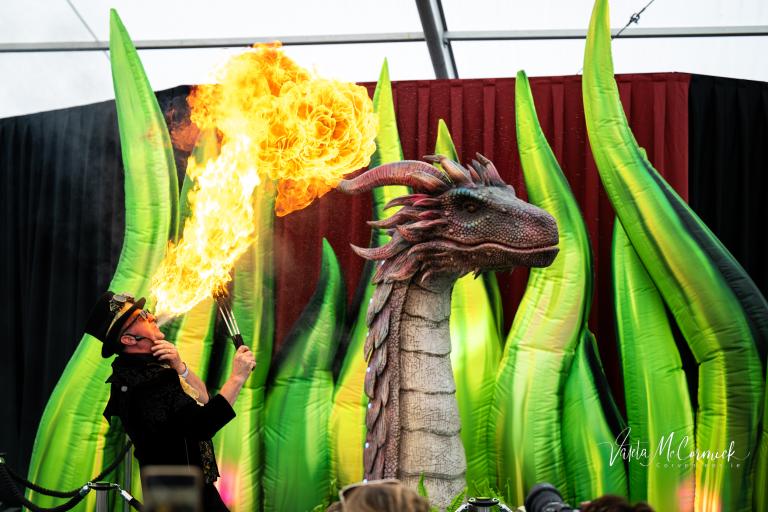 Dragon and man breathing fire