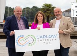 3 People holding a Sign - Carlow Business Day