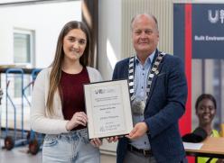 Student receiving award