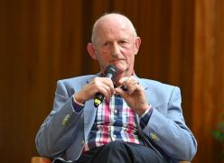 Man Sitting with Microphone