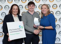 2 women and a man at prize giving