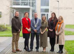 A group standing in front of college