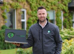 Man Holding a Laptop