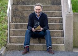 Man Sitting on Steps