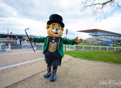Large teddy bear with top hat and cane