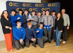 Group of students with teachers and holding trophy