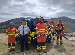Firemen standing at vehicle