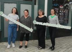 4 Women holding signs