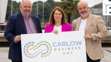 3 People holding a Sign - Carlow Business Day