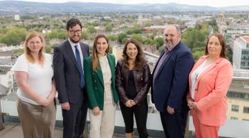 6 People standing on roof balcony