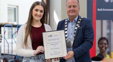 Student receiving award
