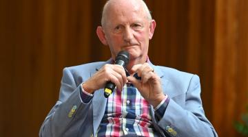 Man Sitting with Microphone