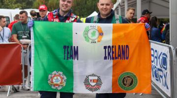 2 firemen with ireland flag