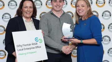 2 women and a man at prize giving
