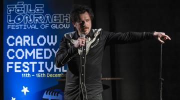 Man on stage with microphone