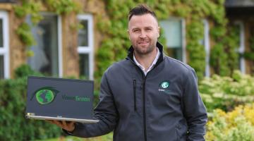 Man Holding a Laptop