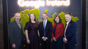 People standing at Google Ireland Sign