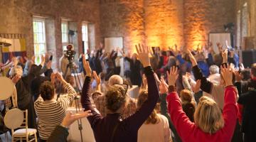 Group with arms in the air