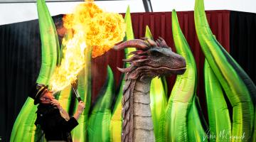Dragon and man breathing fire