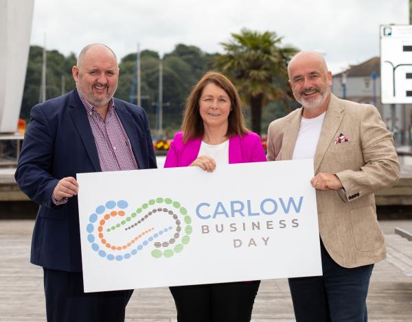 3 People holding a Sign - Carlow Business Day